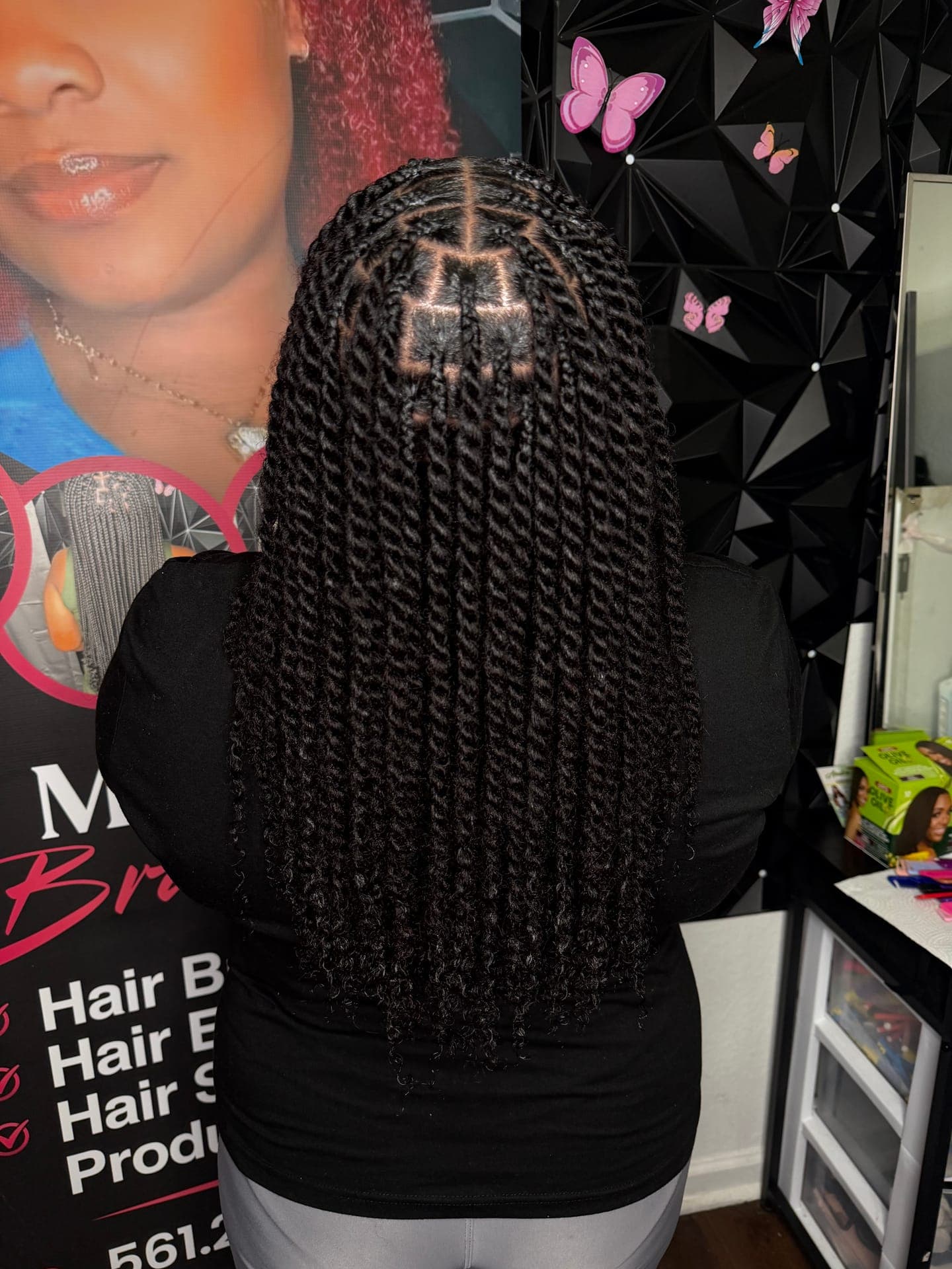 Back-of-head view of finished black twists