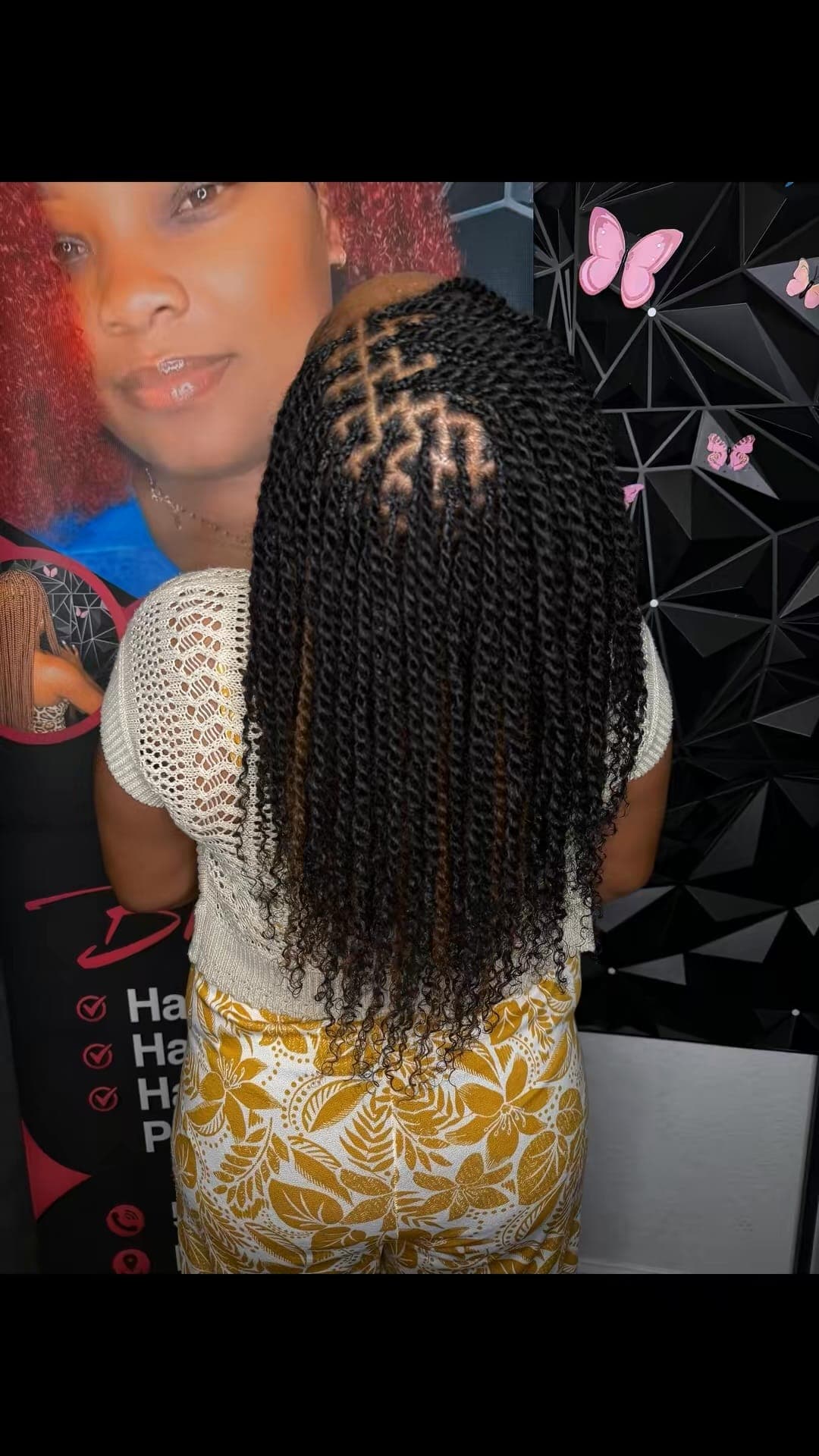 Back-of-head view of ombre senegalese twists with caramel highlights