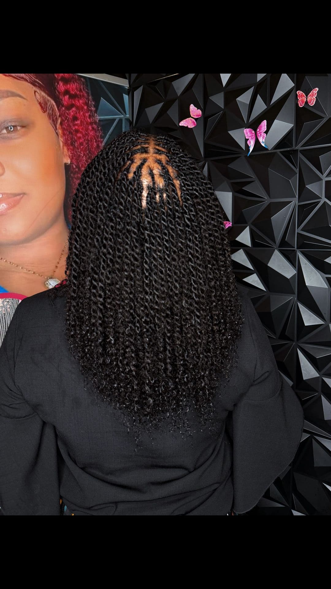 Back-of-head view of black senegalese twists